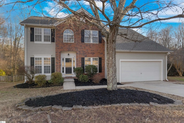 colonial inspired home featuring a garage