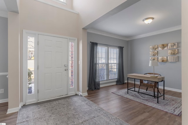 foyer entrance with crown molding and hardwood / wood-style flooring