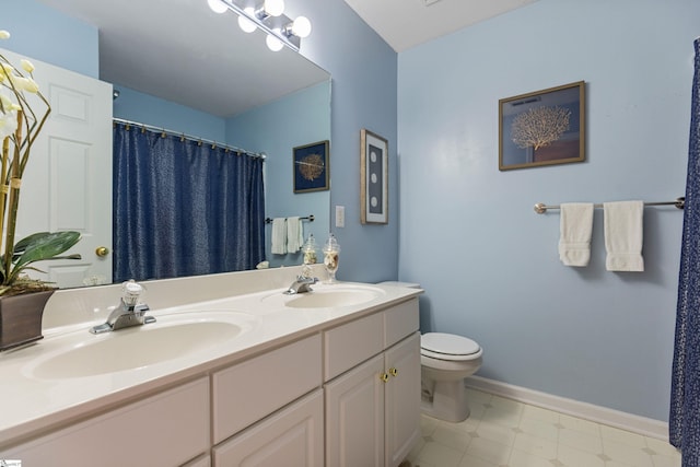 bathroom with a shower with shower curtain, vanity, and toilet