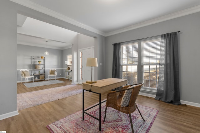 office space with wood-type flooring and crown molding