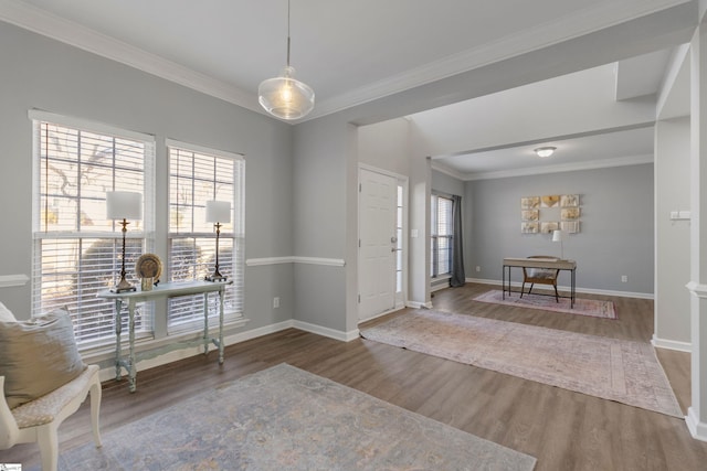 entryway featuring hardwood / wood-style floors and ornamental molding