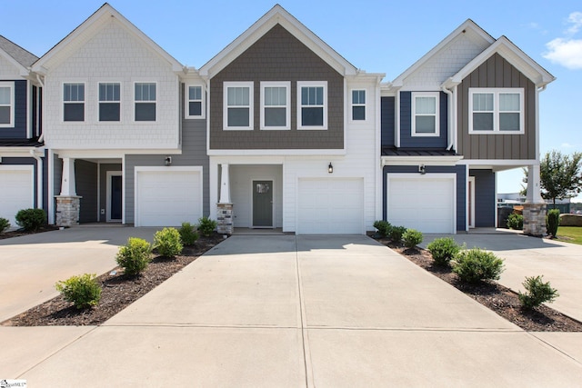 townhome / multi-family property featuring a garage