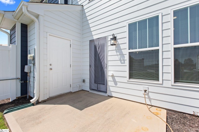 property entrance featuring a patio area