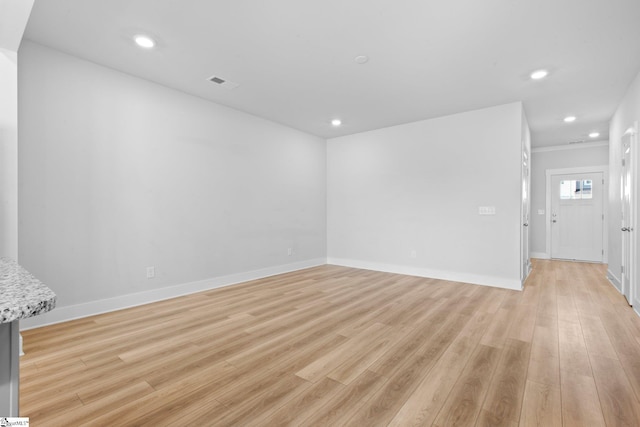 spare room with light wood-type flooring