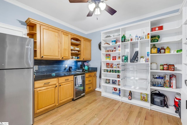 kitchen with decorative backsplash, beverage cooler, ceiling fan, light hardwood / wood-style floors, and stainless steel refrigerator