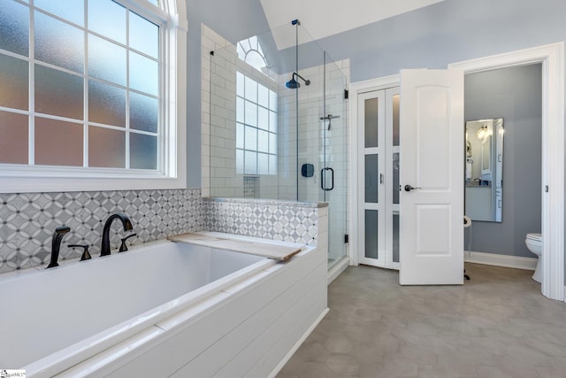 bathroom with tile patterned floors, plus walk in shower, and toilet