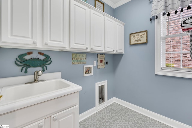 laundry area featuring sink, cabinets, hookup for an electric dryer, hookup for a washing machine, and ornamental molding