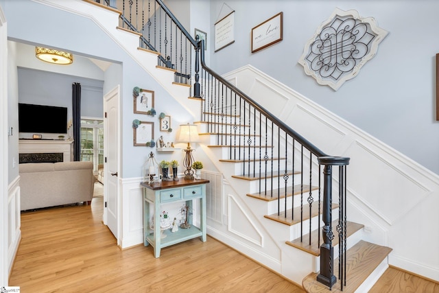 staircase with hardwood / wood-style flooring