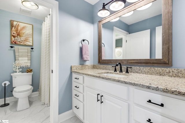 bathroom with vanity and toilet