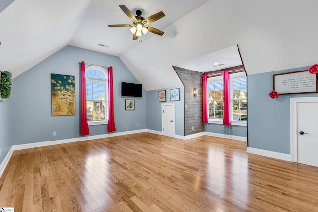 bonus room featuring a healthy amount of sunlight, light hardwood / wood-style flooring, ceiling fan, and lofted ceiling