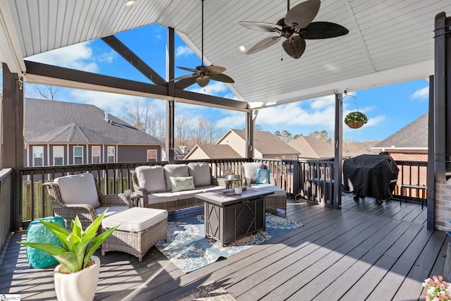 wooden deck featuring outdoor lounge area, area for grilling, and ceiling fan