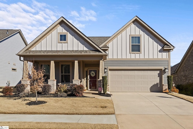 view of front facade with covered porch and a garage