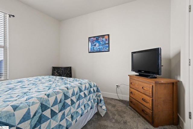 bedroom featuring dark colored carpet