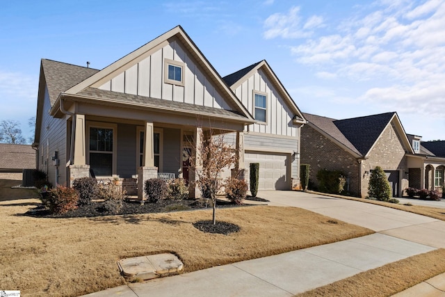 view of front facade featuring covered porch and a garage