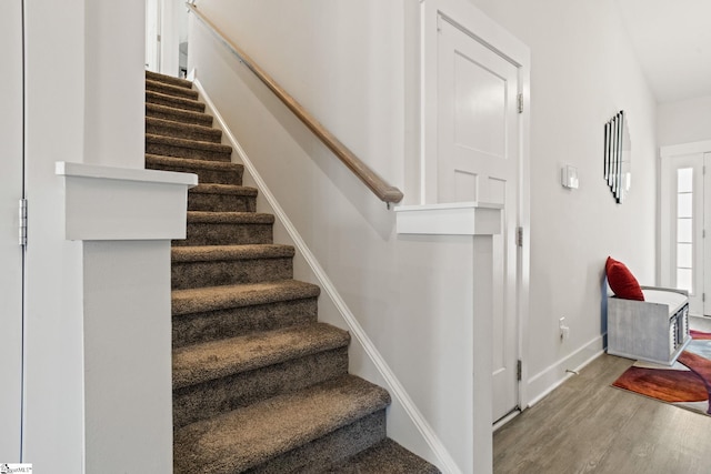 stairs with hardwood / wood-style floors