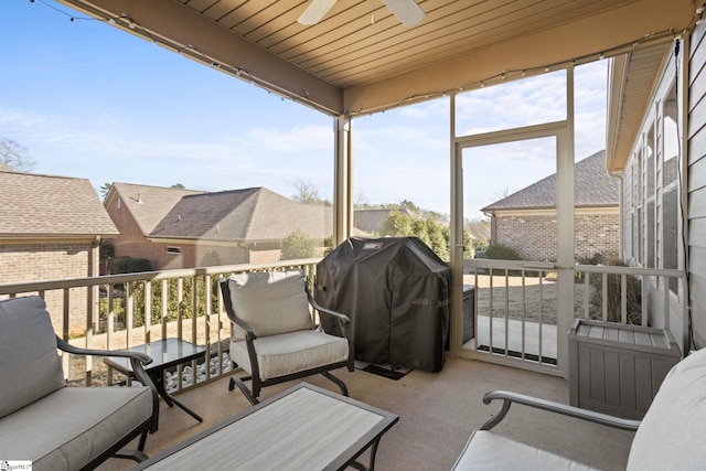 sunroom / solarium with wood ceiling, ceiling fan, and a healthy amount of sunlight