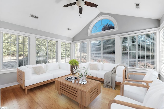 sunroom / solarium with a wealth of natural light, ceiling fan, and lofted ceiling