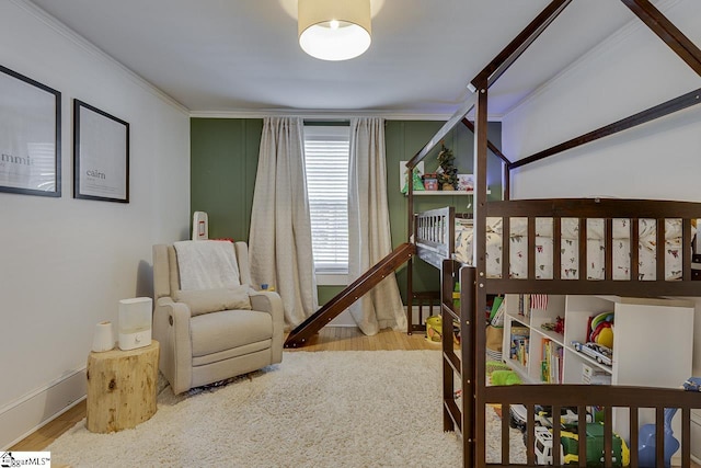 bedroom with ornamental molding and light hardwood / wood-style flooring