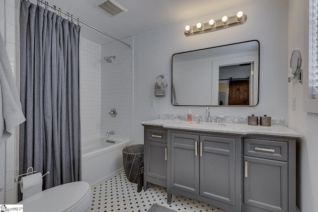 full bathroom featuring shower / tub combo with curtain, vanity, and toilet