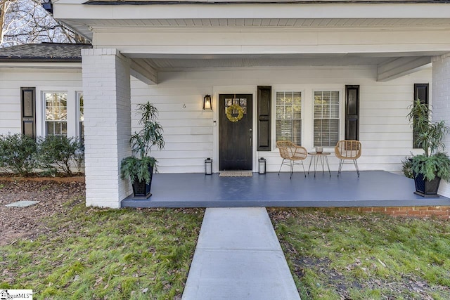 property entrance featuring covered porch