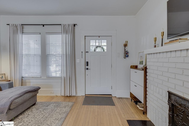 foyer entrance with light wood-type flooring