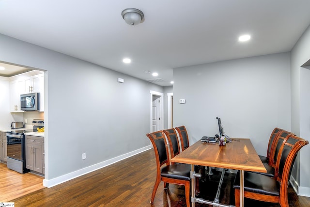 dining space featuring light wood-type flooring