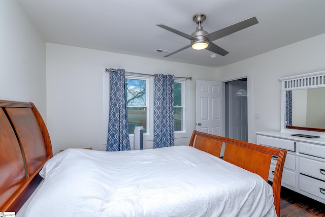 bedroom featuring ceiling fan and dark wood-type flooring