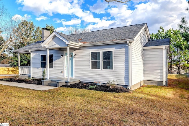 bungalow-style house featuring a front yard