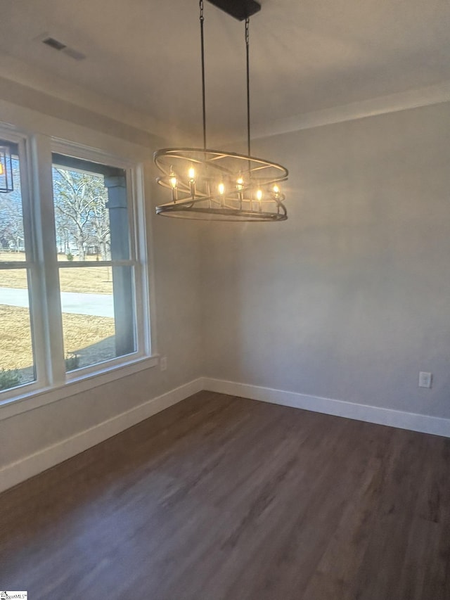 unfurnished dining area featuring dark hardwood / wood-style flooring