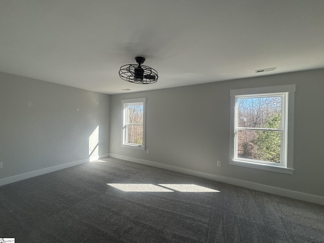 empty room with carpet flooring and ceiling fan