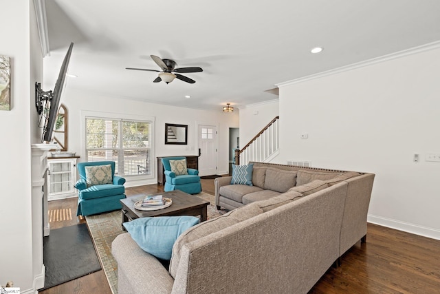 living room with ceiling fan, dark hardwood / wood-style floors, and ornamental molding