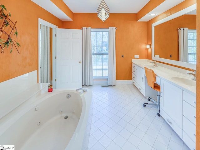 bathroom with tile patterned flooring, a bath, and vanity