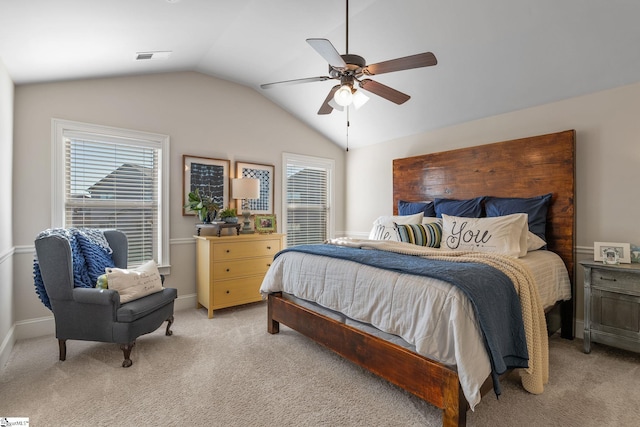 bedroom with light colored carpet, ceiling fan, and lofted ceiling