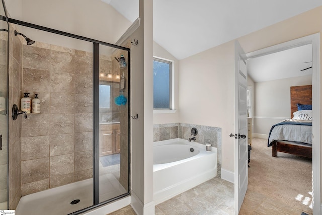 bathroom with shower with separate bathtub and lofted ceiling