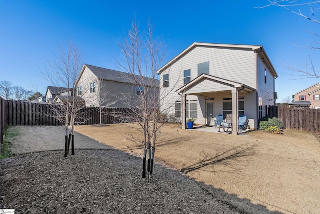 rear view of house with a patio area