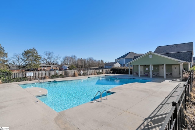 view of swimming pool featuring a patio area