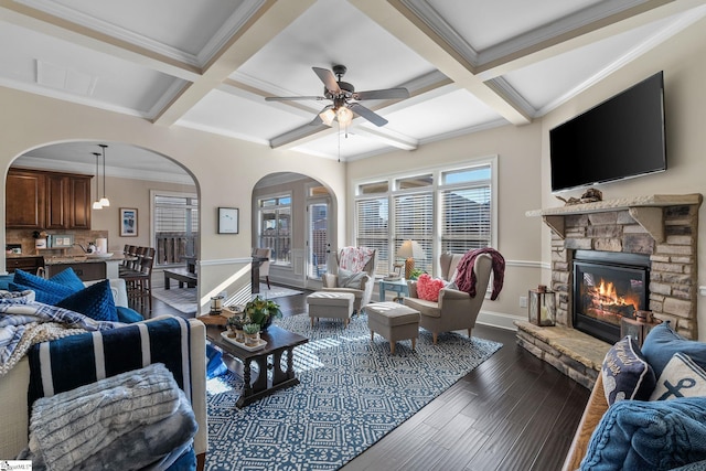 living room with hardwood / wood-style floors, beamed ceiling, and coffered ceiling