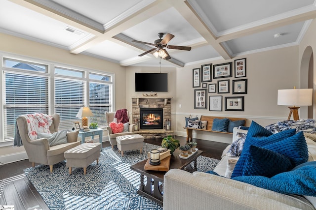 living room featuring hardwood / wood-style floors, a fireplace, beamed ceiling, and coffered ceiling