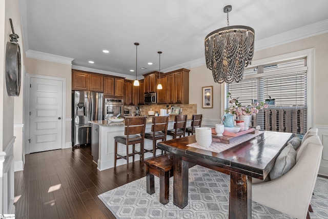 dining area with a notable chandelier, crown molding, and dark wood-type flooring