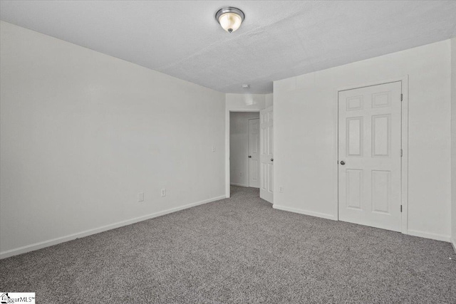 unfurnished bedroom featuring carpet flooring and a textured ceiling