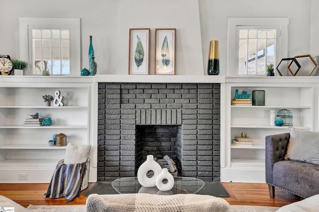 living room featuring hardwood / wood-style flooring and a fireplace