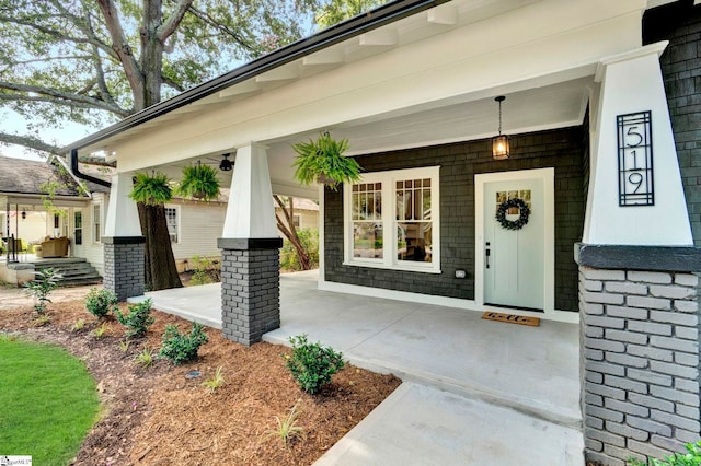 entrance to property featuring covered porch