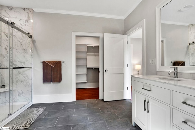 bathroom featuring vanity, ornamental molding, and walk in shower