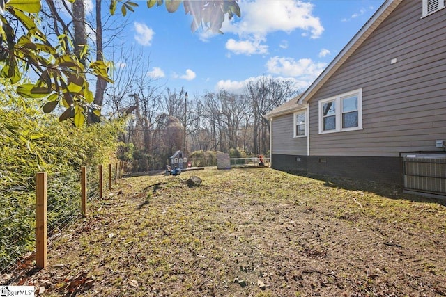 view of yard featuring central AC unit