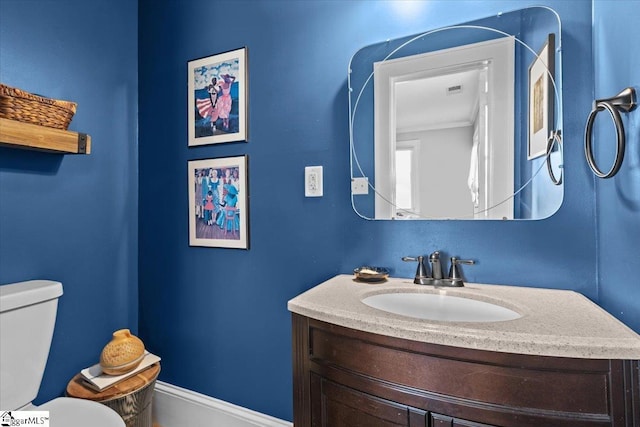 bathroom with vanity and toilet