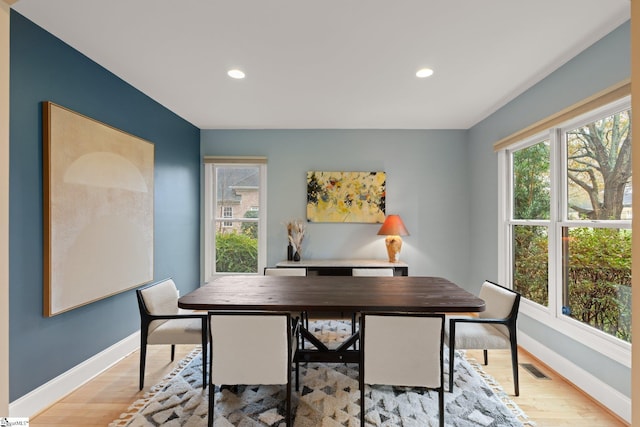 dining area with light hardwood / wood-style floors