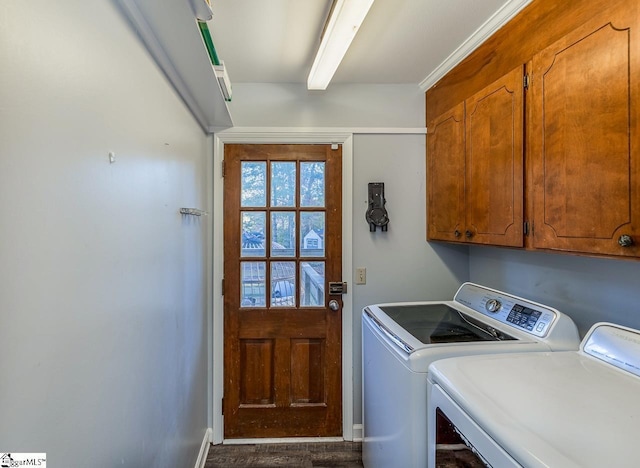 laundry room featuring cabinets and independent washer and dryer