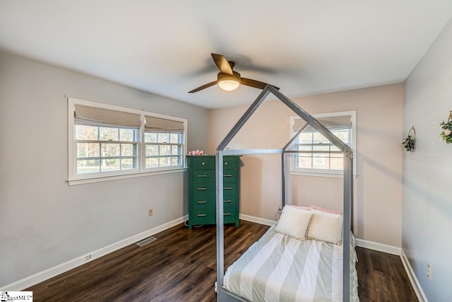 bedroom featuring ceiling fan and dark hardwood / wood-style flooring