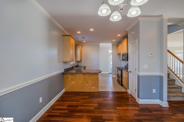 kitchen with kitchen peninsula, dark hardwood / wood-style flooring, crown molding, and black appliances