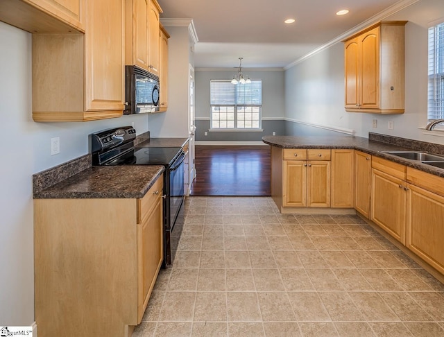 kitchen featuring black appliances, sink, hanging light fixtures, kitchen peninsula, and a chandelier